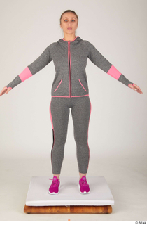 Mia Brown a poses dressed grey hoodie grey leggings pink…